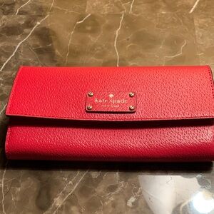 Kate Spade Vibrant Red Leather Wallet width 4 inches ,long 7.5 inches